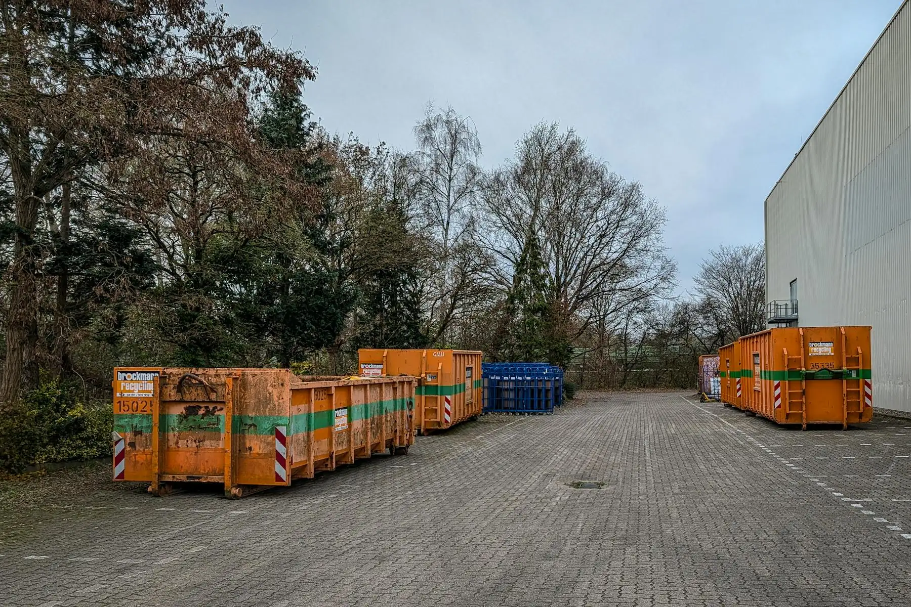 Row of debris containers of different sizes