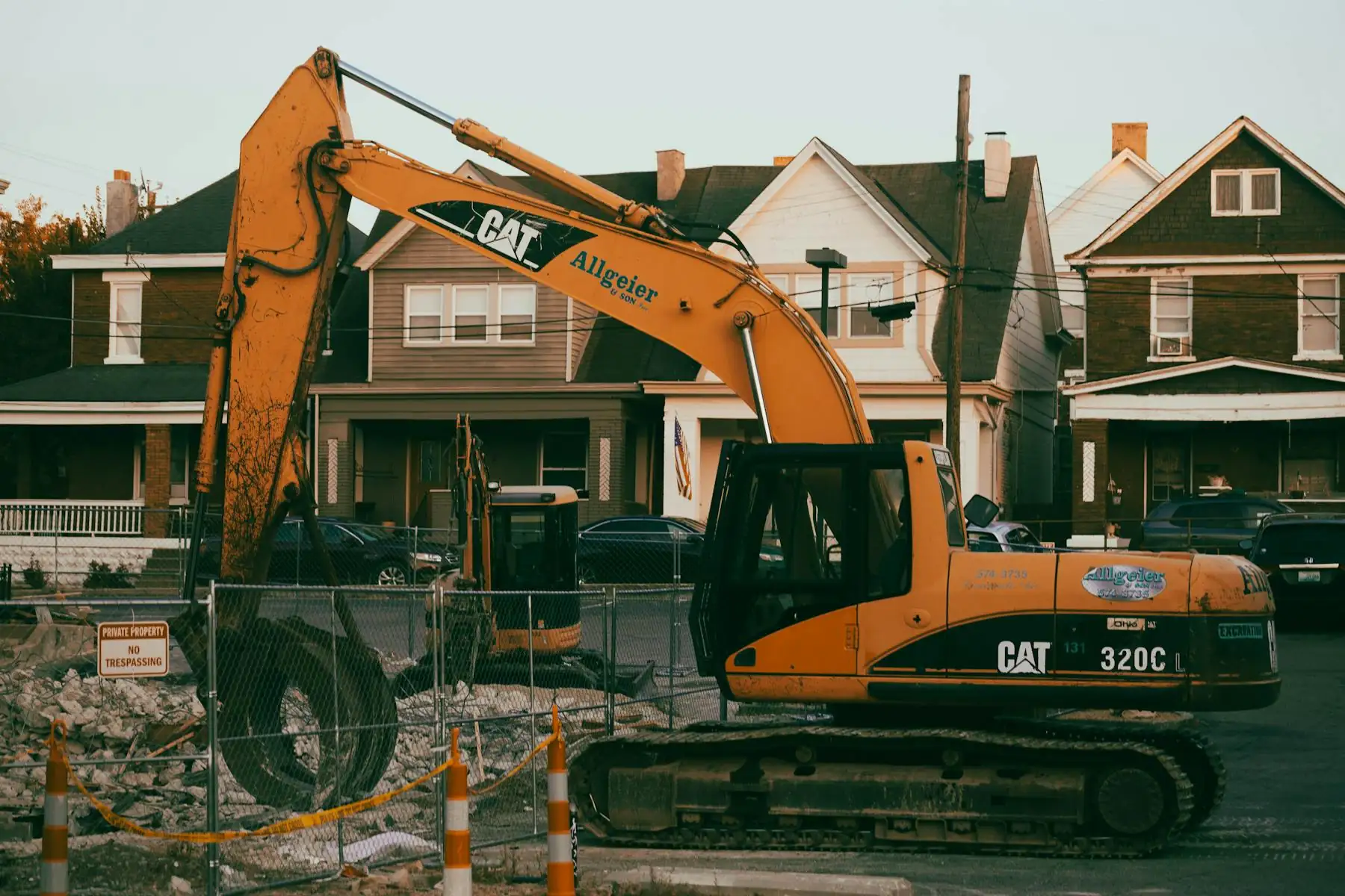 Equipment clearing landscape material at a home